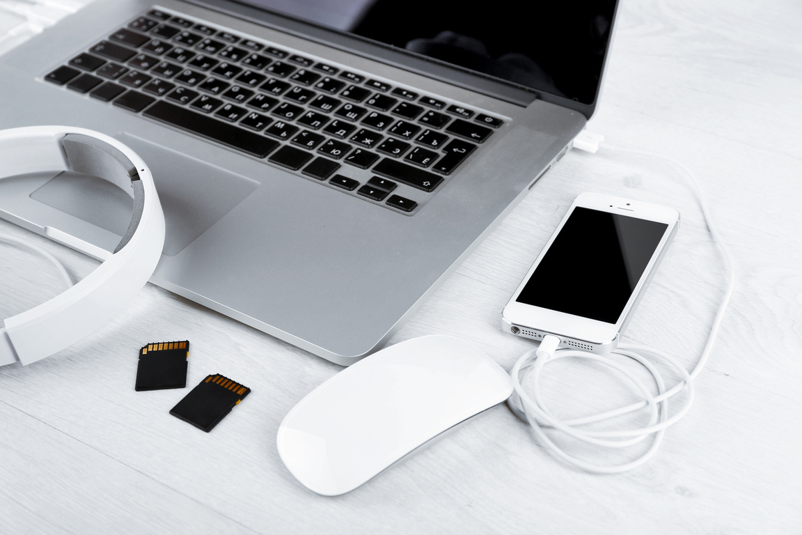 Computer Peripherals and Laptop Accessories on White Wooden Background