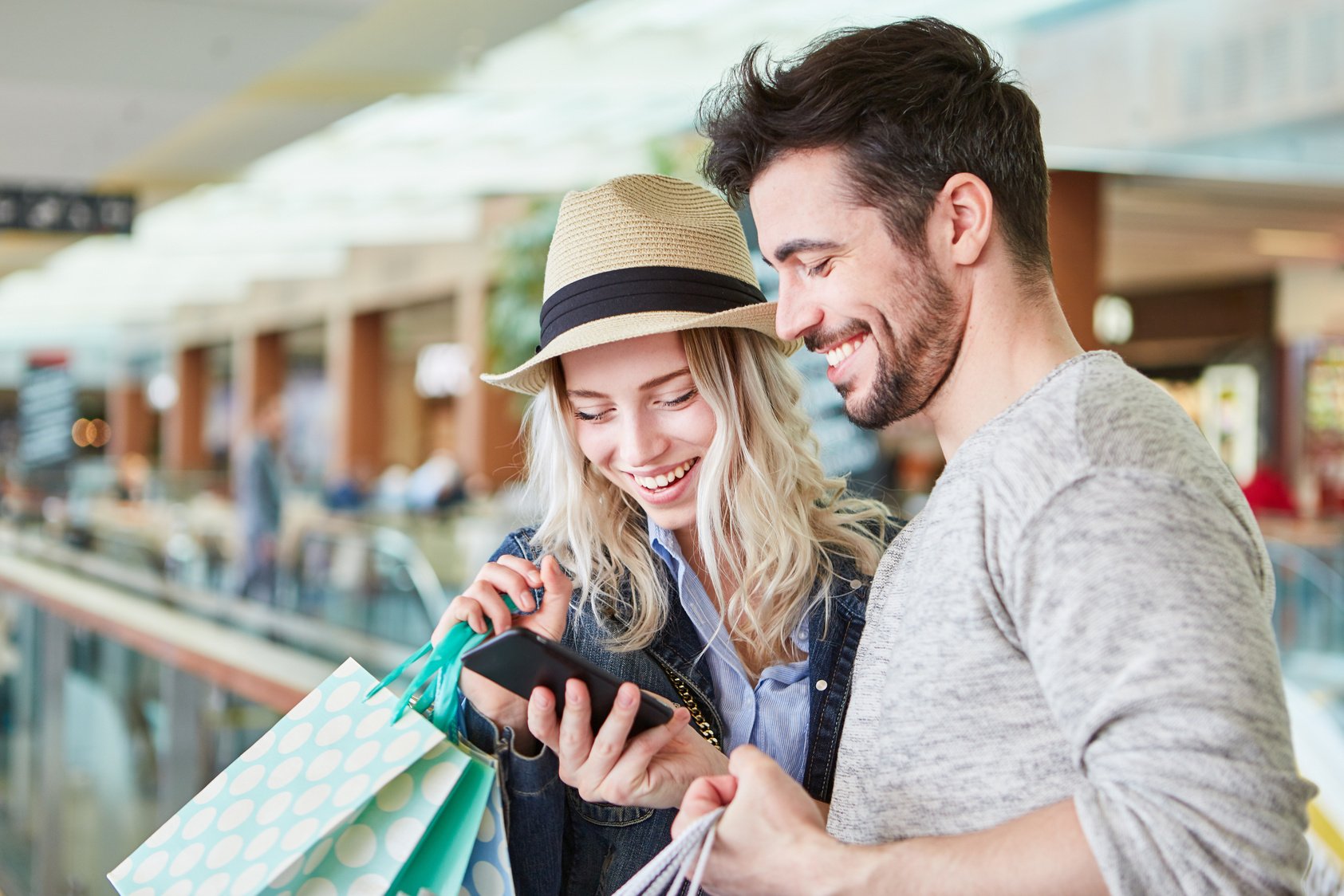 Couple with Phone while Shopping